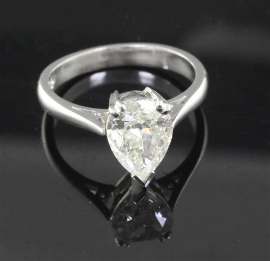 A modern platinum and solitaire pear cut diamond ring, Size P.